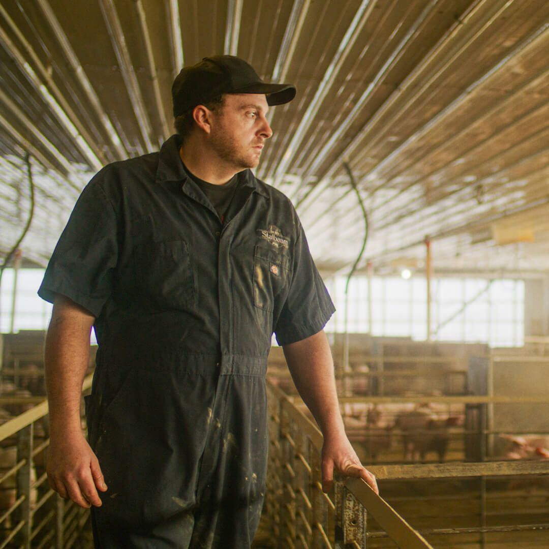Derrick Staulbaum in hog barn