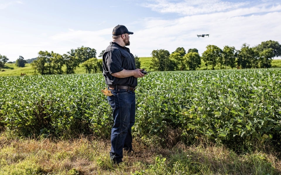 Farmer using drone financed by Farm Credit Mid-America.
