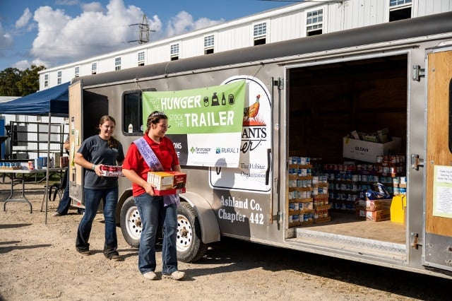 Ohio 4-H members stock trailer with donated food