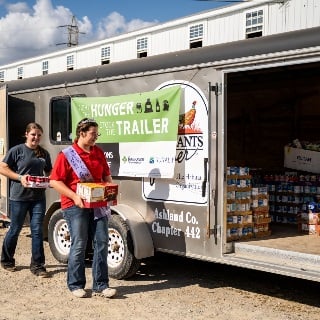 Ohio 4-H members stock trailer with donated food
