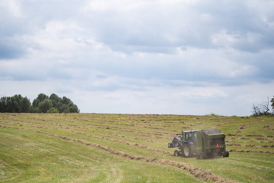 Tractor baling hay insured through PRF policy