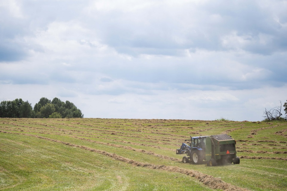 Tractor baling hay insured through PRF policy