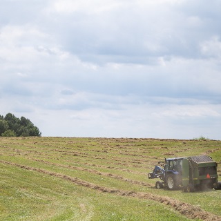 Tractor baling hay insured through PRF policy