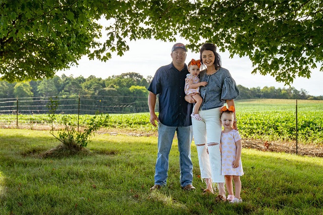 Lay Family poses for a photo next to their row crop field financed by Farm Credit Mid-America