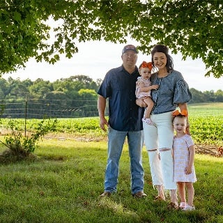 Lay Family poses for a photo next to their row crop field financed by Farm Credit Mid-America