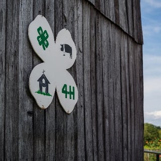 4-H sign showcased on a Farm Credit Mid-America customers barn.