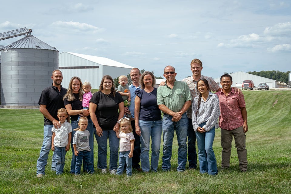 Indiana family pose for photo on commercial ag operation financed by Farm Credit Mid-America