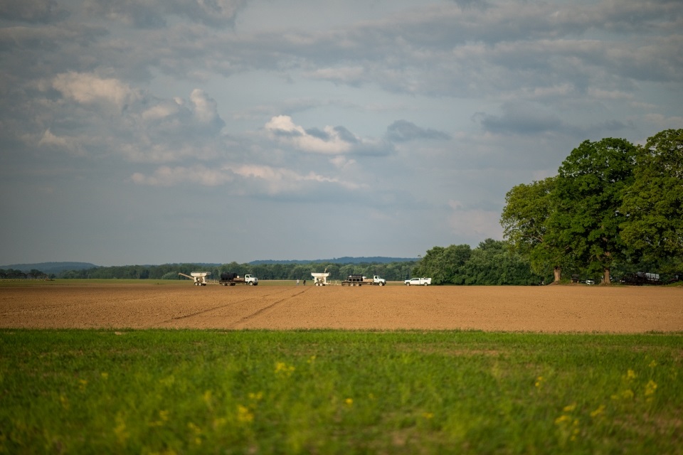 Line of farm equipment getting ready to plant on land financed with a Farm Credit Mid-America agricultural loan