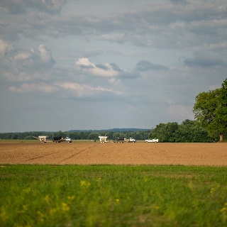 Line of farm equipment getting ready to plant on land financed with a Farm Credit Mid-America agricultural loan