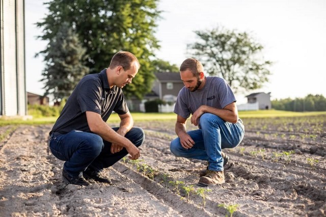 Farm Credit Mid-America financial officer explains agricultural credit decision factors to a customer