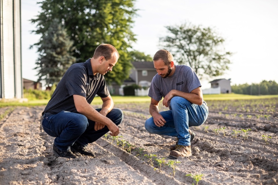 Farm Credit Mid-America financial officer explains agricultural credit decision factors to a customer