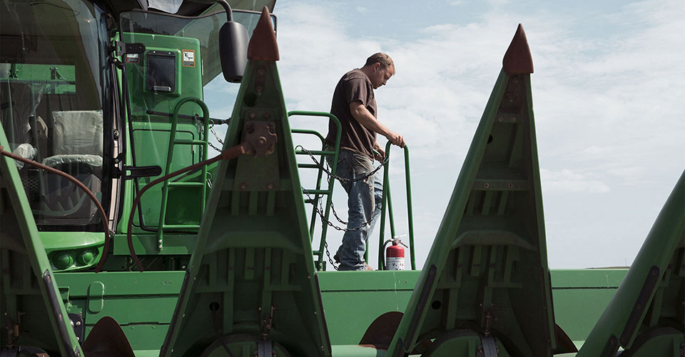 Man stepping out of combine.