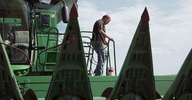 Combine bought with a farm equipment finance loan from Farm Credit Mid-America.