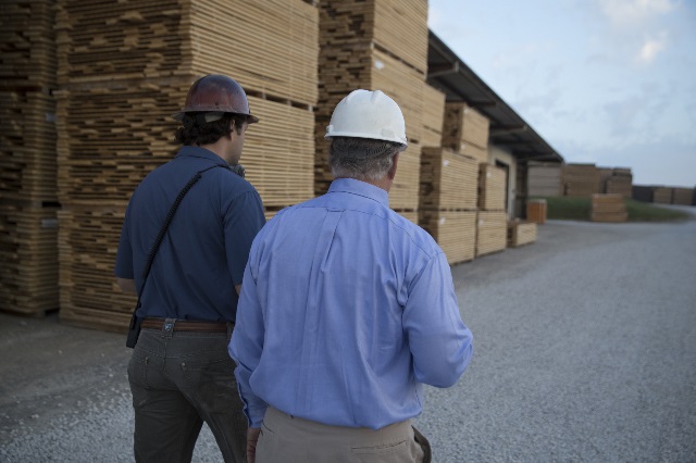 Sawmill owner discusses financials with his Farm Credit Mid-America lender