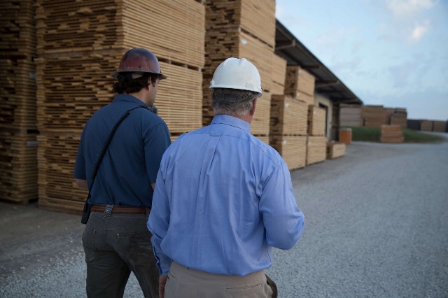 Sawmill owner discusses financials with his Farm Credit Mid-America lender