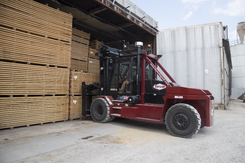 Forklift moving lumber