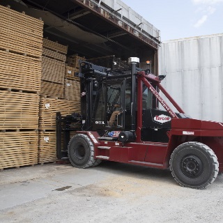 Forklift moving lumber