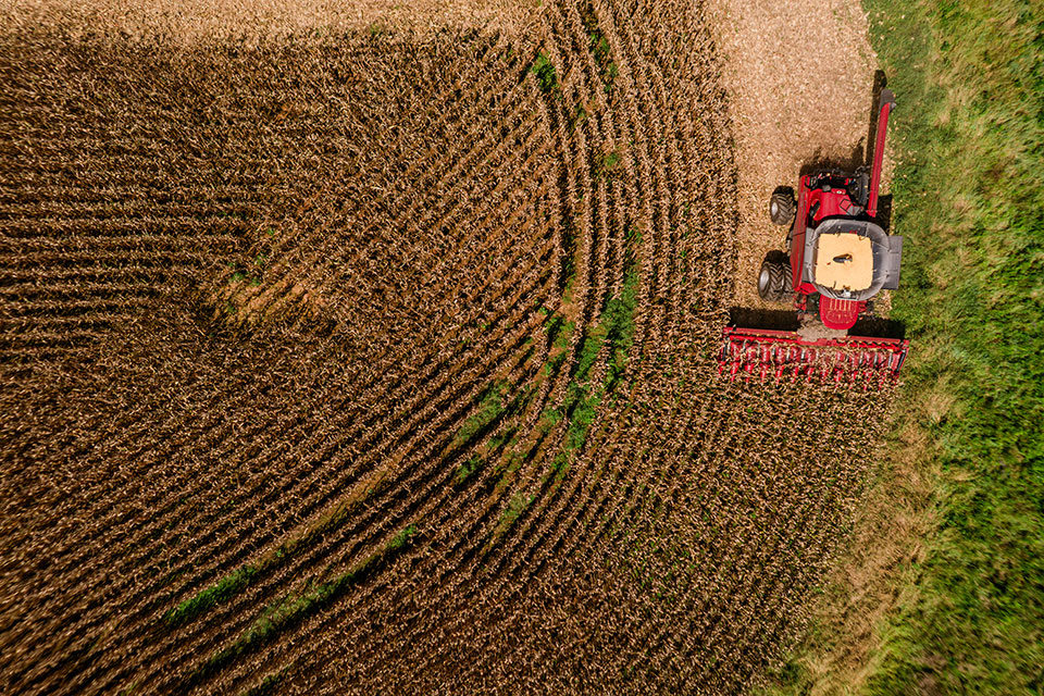 Hutchinson-280-opt Aerial view of a farm vehicle in a field.