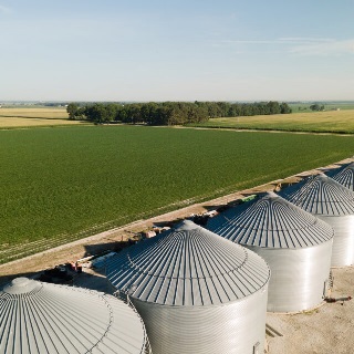 Grain bins and farm land bought with farm loans from Farm Credit Mid-America.