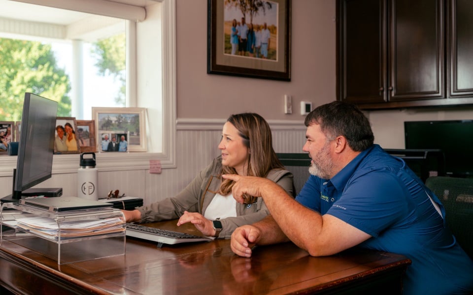 Farmers use Farm Credit Mid-America's myAccount on their office computer