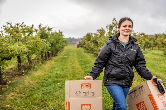 Team member gleaning fruit at Farms to Food Banks