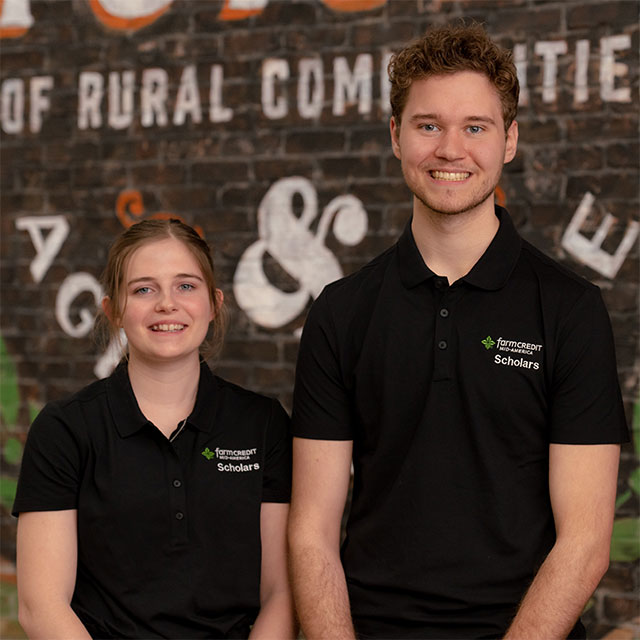 FCMA Scholars posing in front of a mural