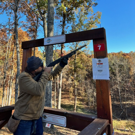 Man competing in Shooting Hunger clay shooting competition
